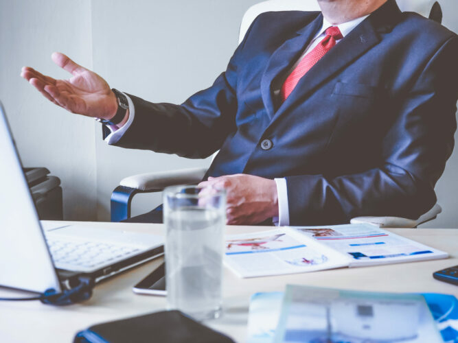 man-raising-right-hand-stockpack-pexels